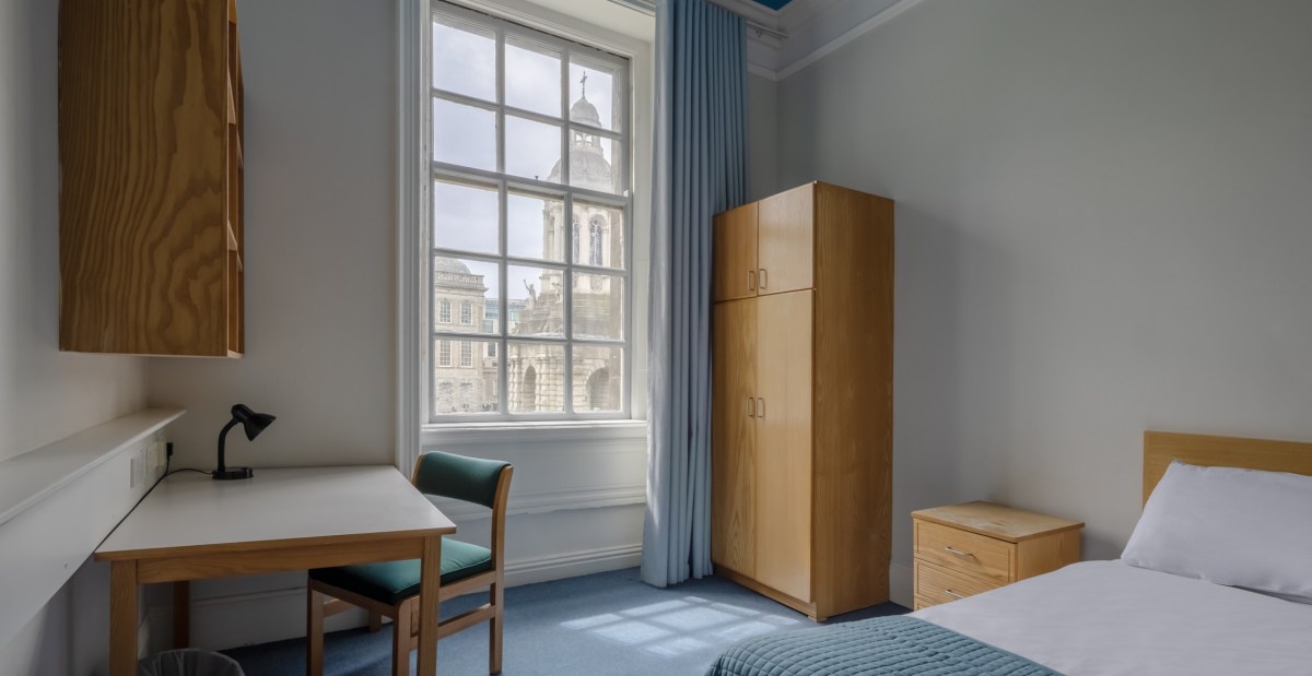 heritage single room with bed and window in trinity college dublin