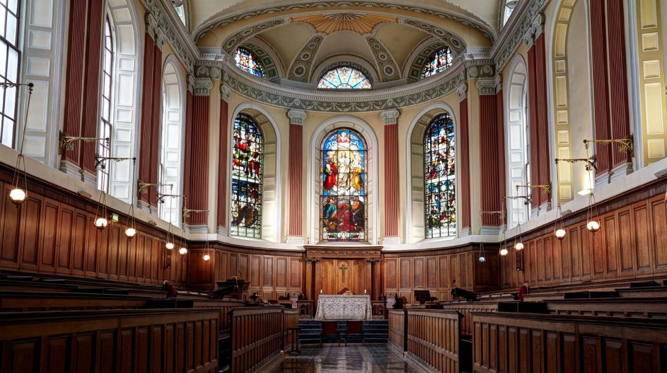 wood panelled room with stained glass in trinity chapel