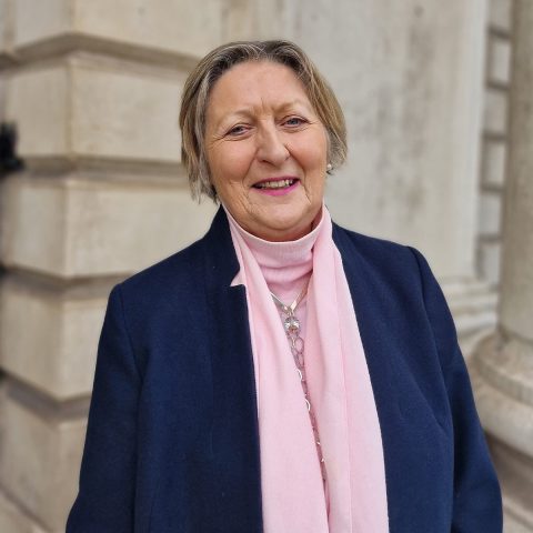 woman in pink scarf