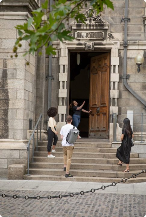 tour guide on steps with visitors on trinity trails campus tour