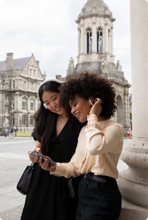 two women on a self guided tour around trinity college dublin