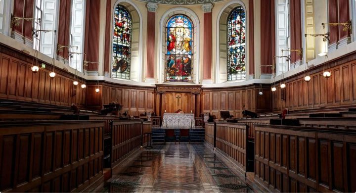 trinity chapel with stained glass windows and wood panelling