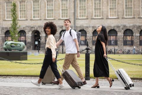 guests staying at trinity college accommodation with suitcases