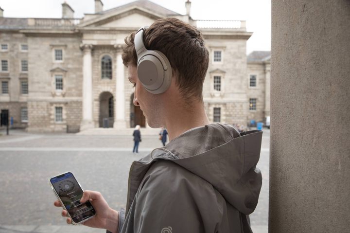 visitor on self guided tour around trinity college