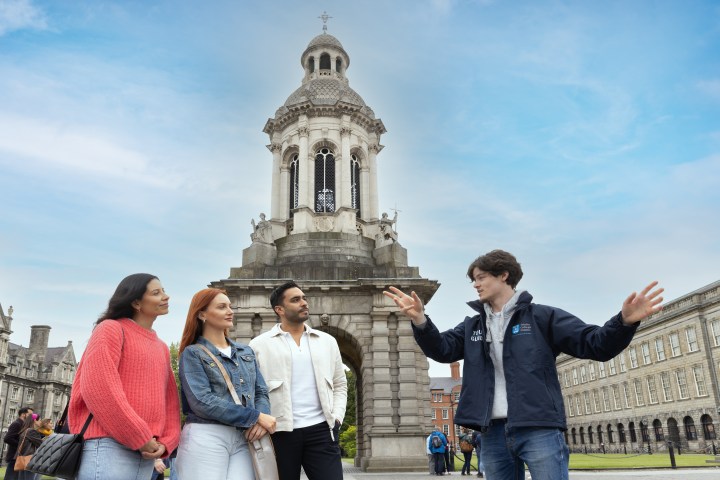 people with tour guide at campanile