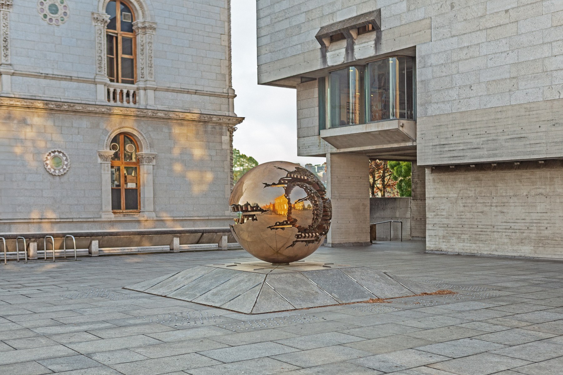 pomodoro sculpture of earth in Trinity college dublin