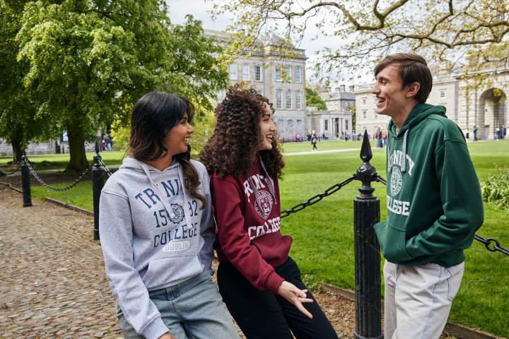 3 Trinity students wearing Trinity hoodies