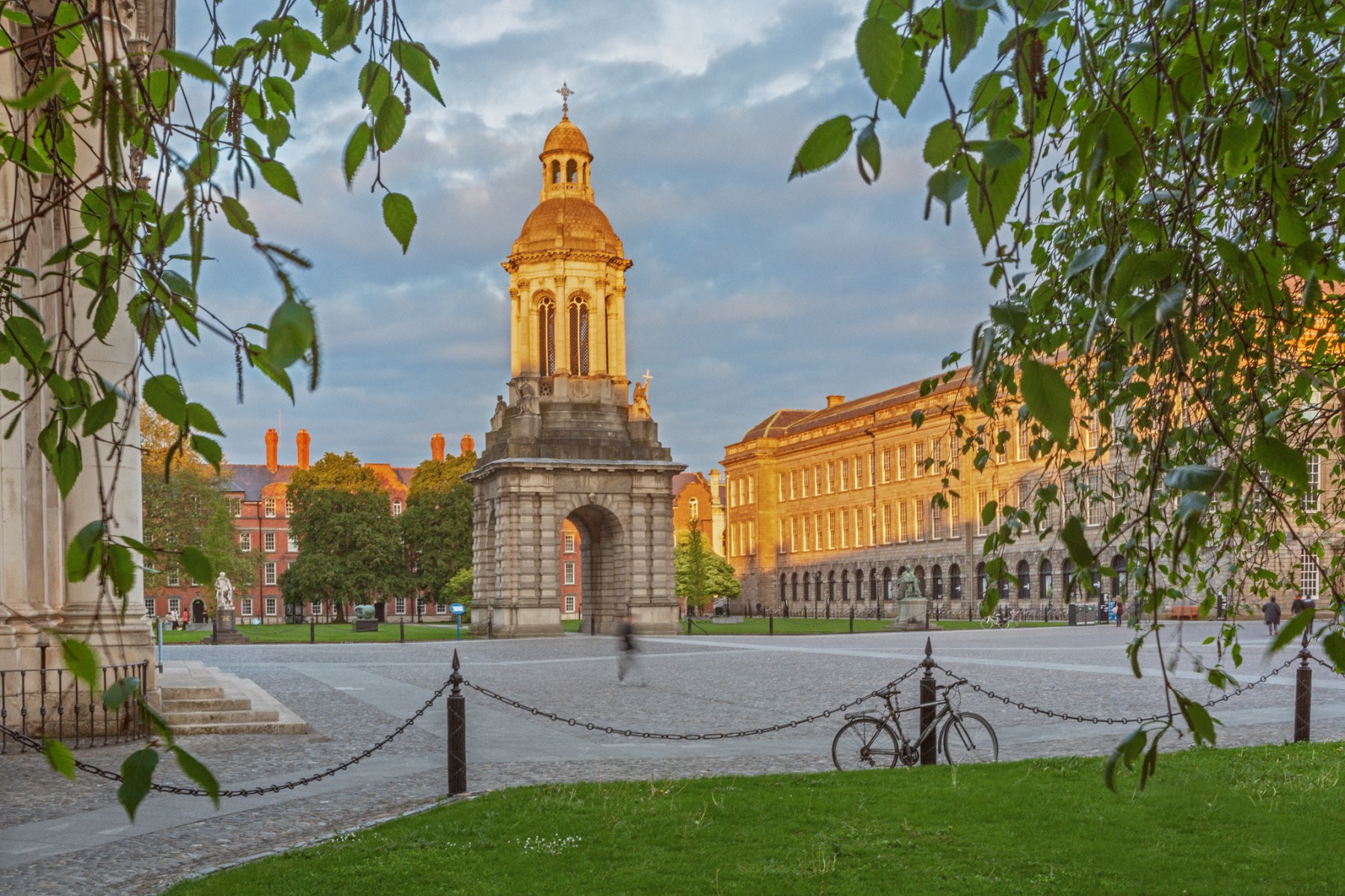 Front Square at Trinity with green leafy trees and the bell tower