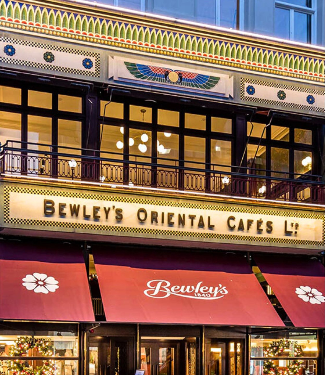 The exterior of Bewleys Café with red awning and colourful designs over the windows