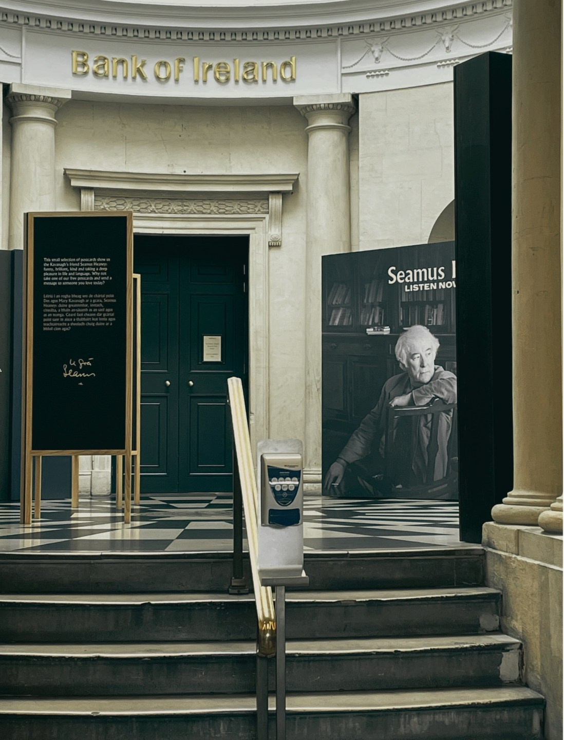 Steps up to the Seamus Heaney Exhibition with a chequred black and white floor