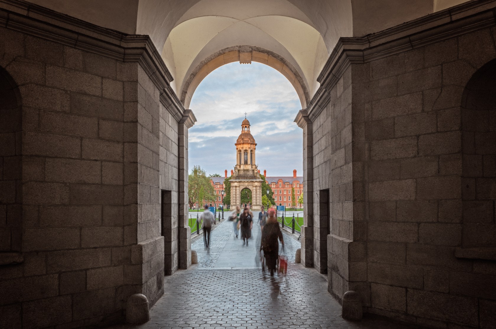 Walking through the Front arch at Trinity College with the bell tower straight ahead