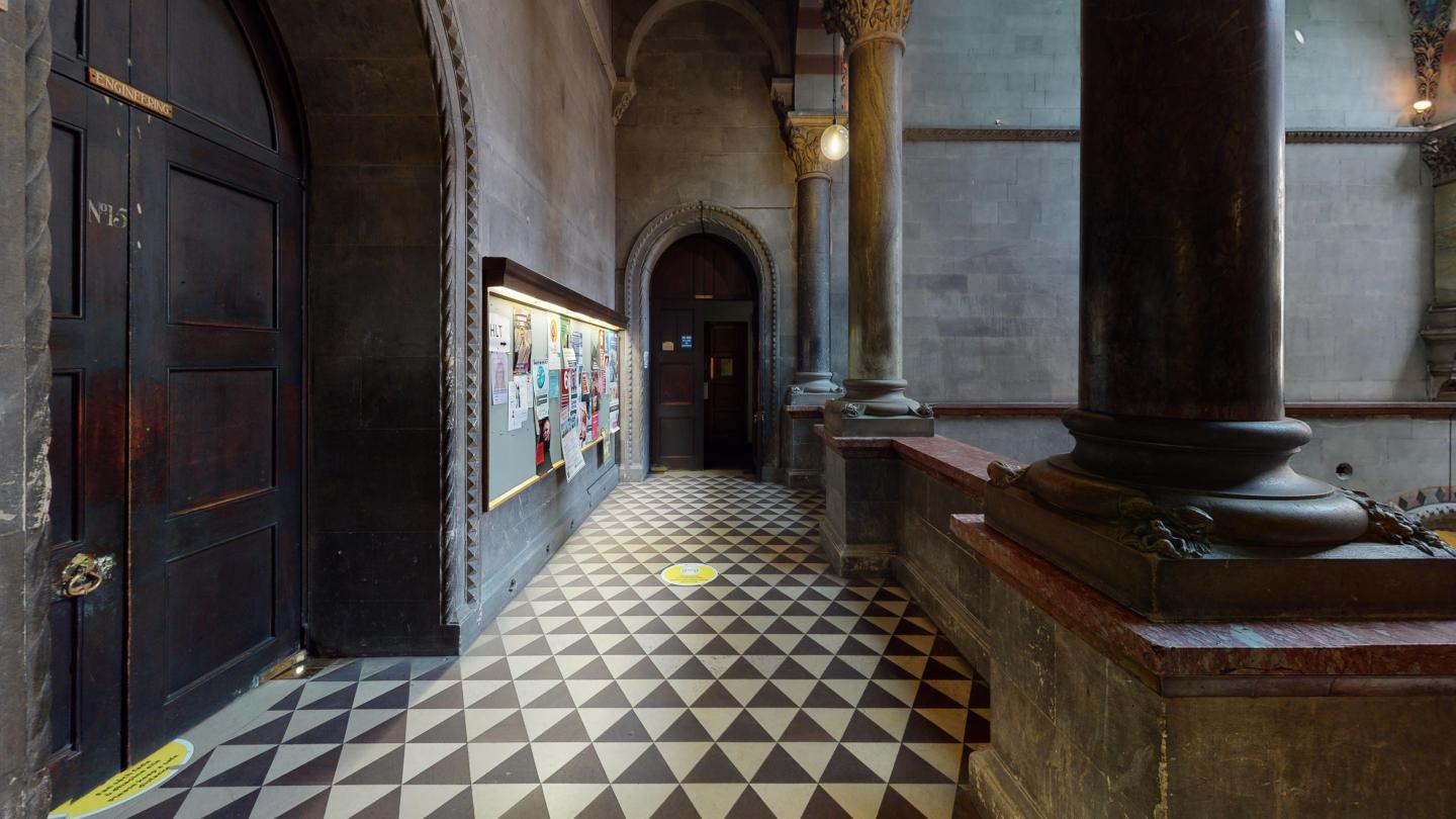 Brown door chequered floor and marble columns at the museum building