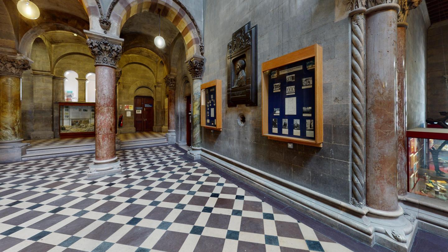 Marble pillar, arch and chequered floor