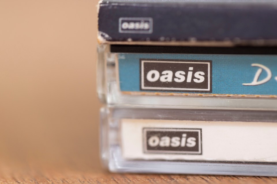 A stack of 3 CDs that have the logo for OASIS on them