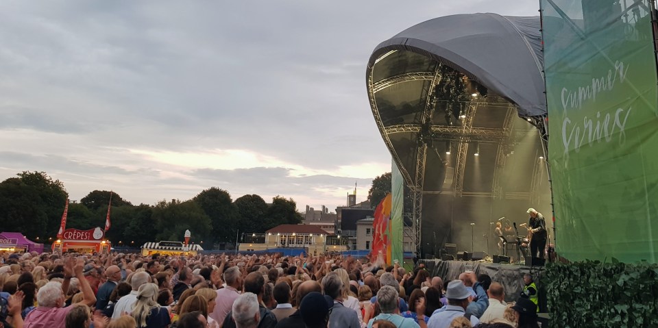 Dome shaped stage stage with crowd on front of it